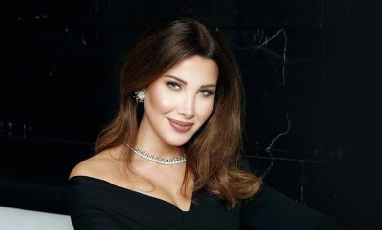 بالصور - نانسي عجرم تصافح اسرائيليًا وتتعرض لهجوم عنيف!